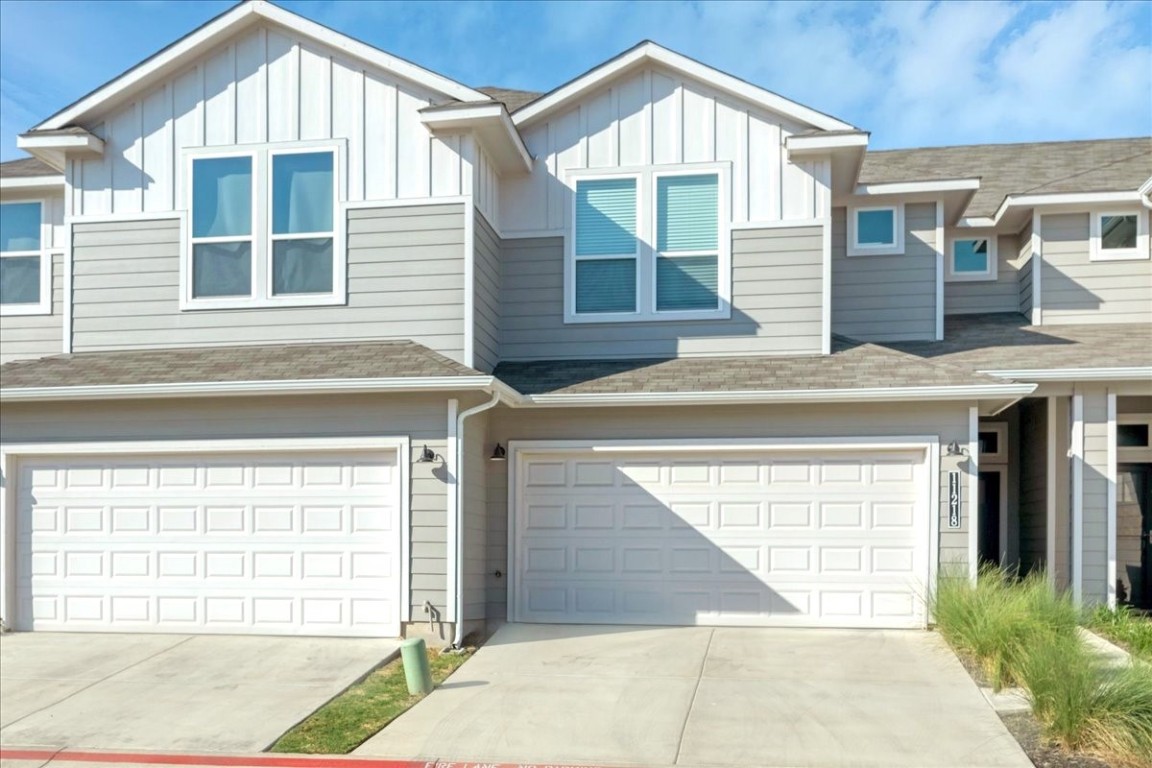 a front view of a house with a garage