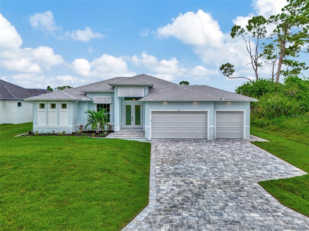 a front view of a house with garden