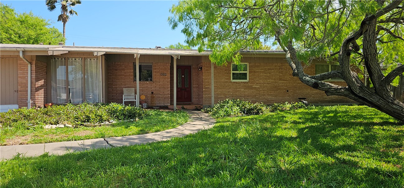 front view of a house with a yard