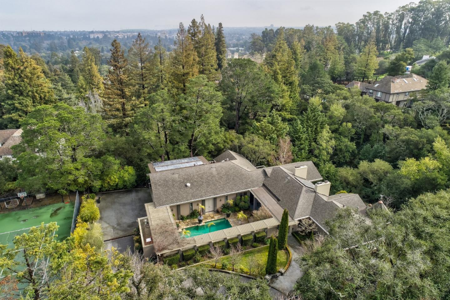 an aerial view of a house with a yard