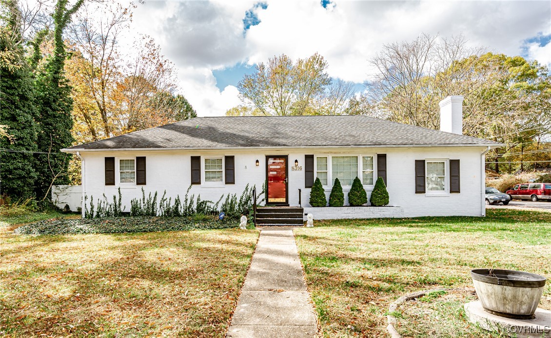 View of front of property with a front yard