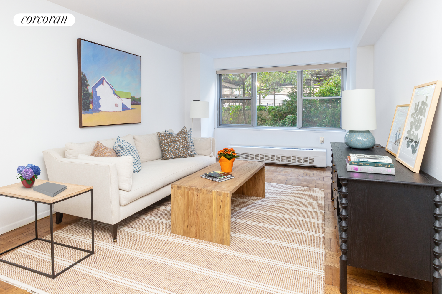 a living room with furniture and a large window