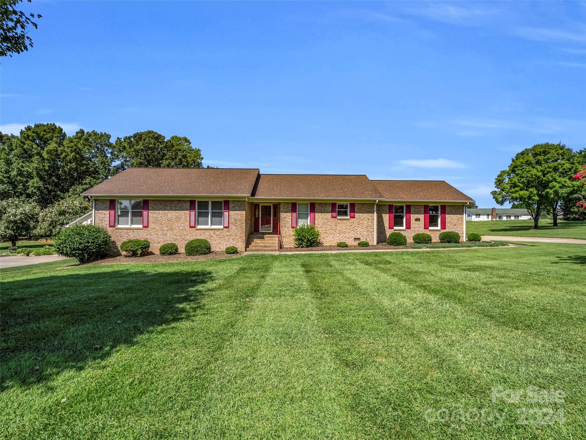 a front view of house with yard and outdoor seating