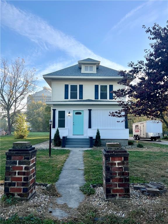 front view of a house with a yard