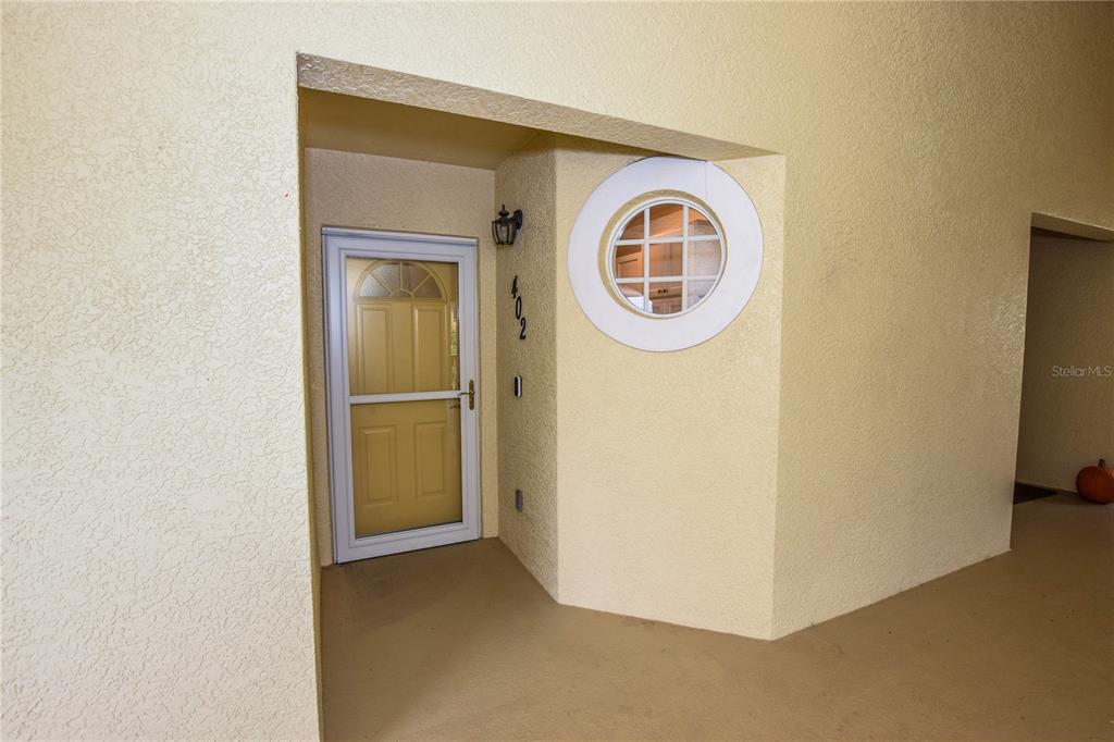 a view of a storage & utility room with a door