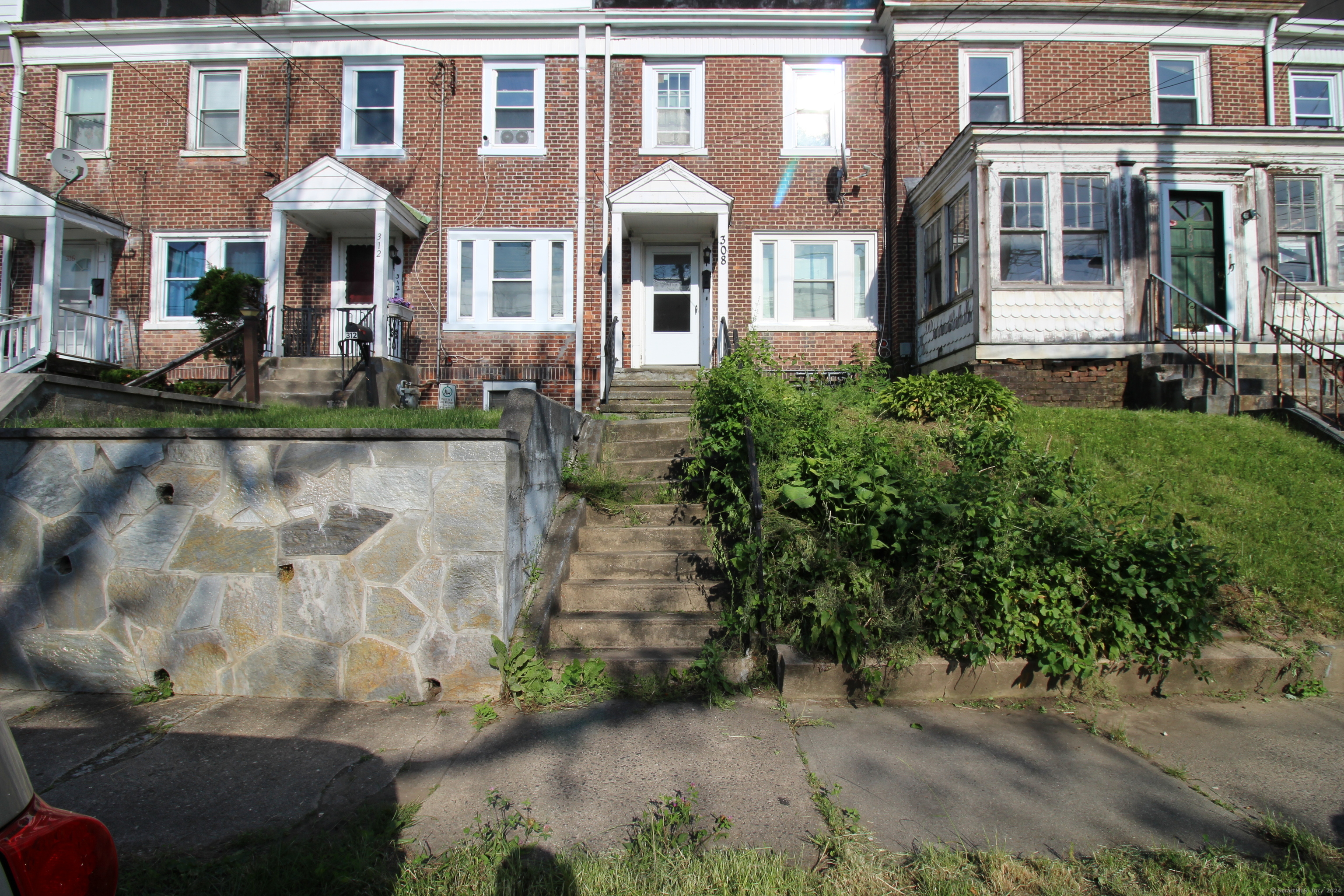 a front view of a house with garden