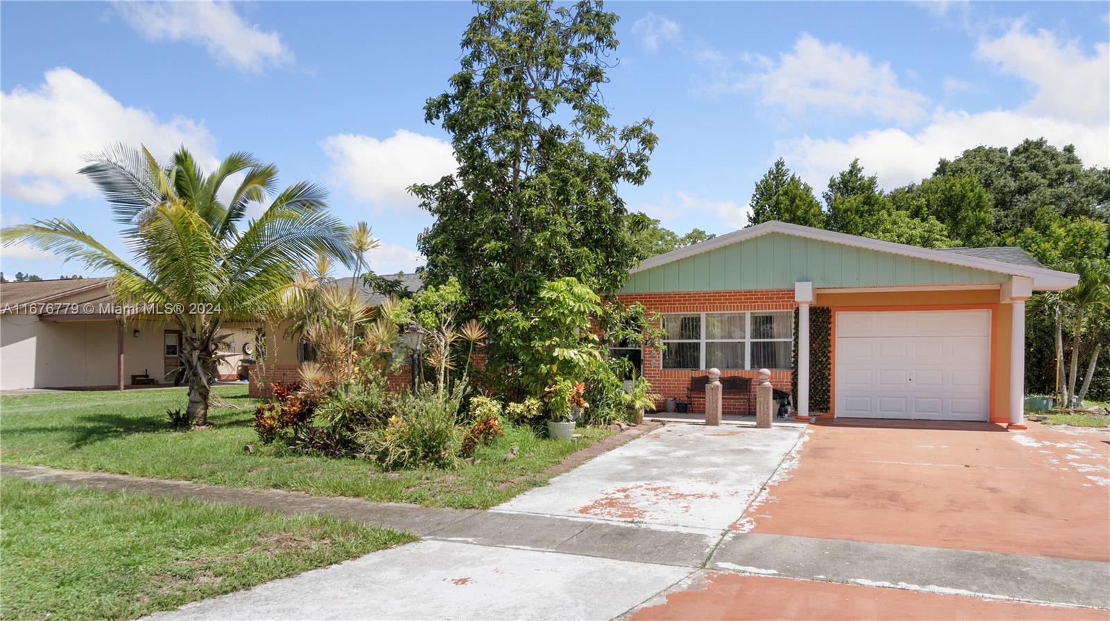 front view of a house with a garden