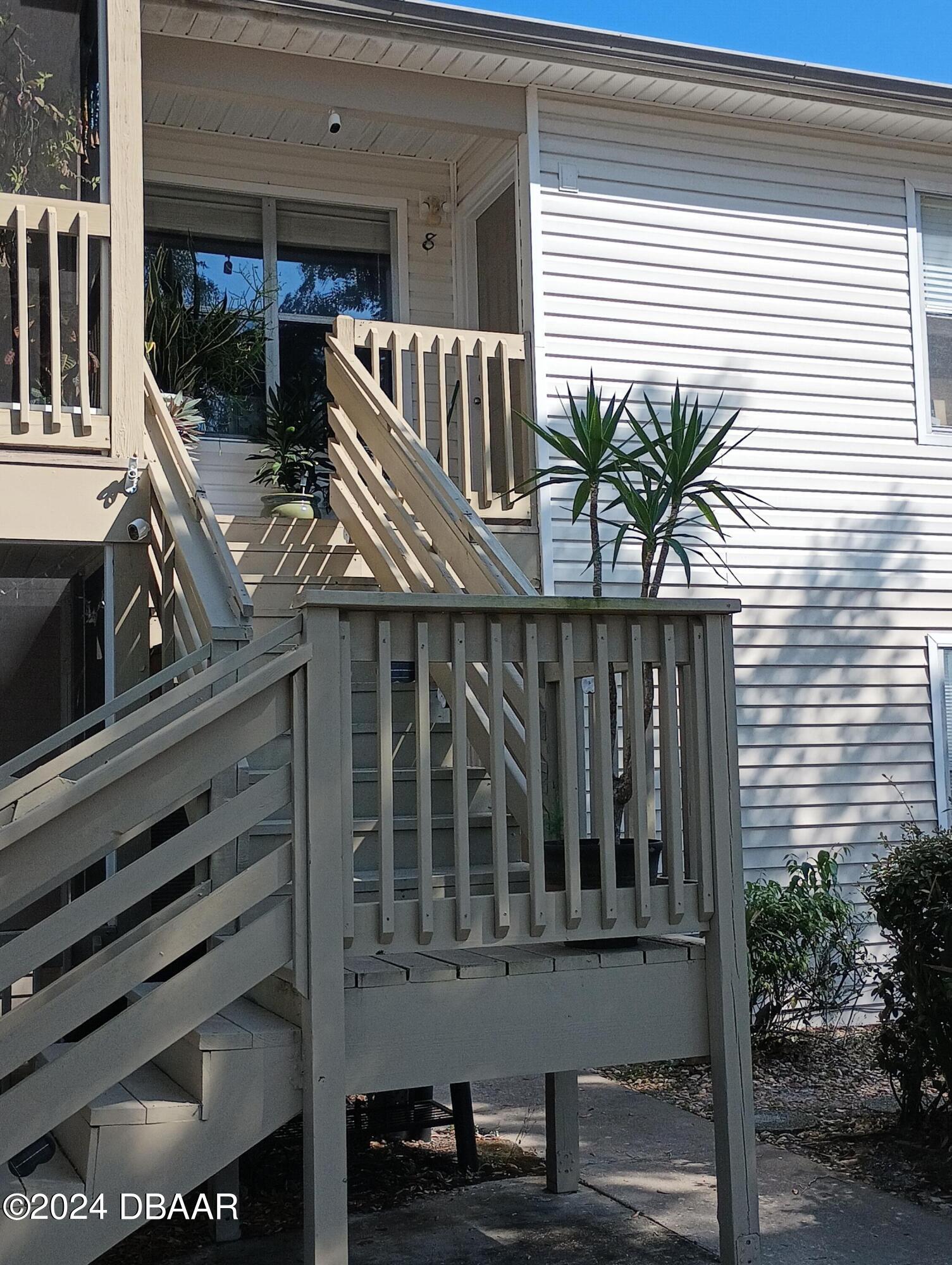 a view of balcony with wooden floor