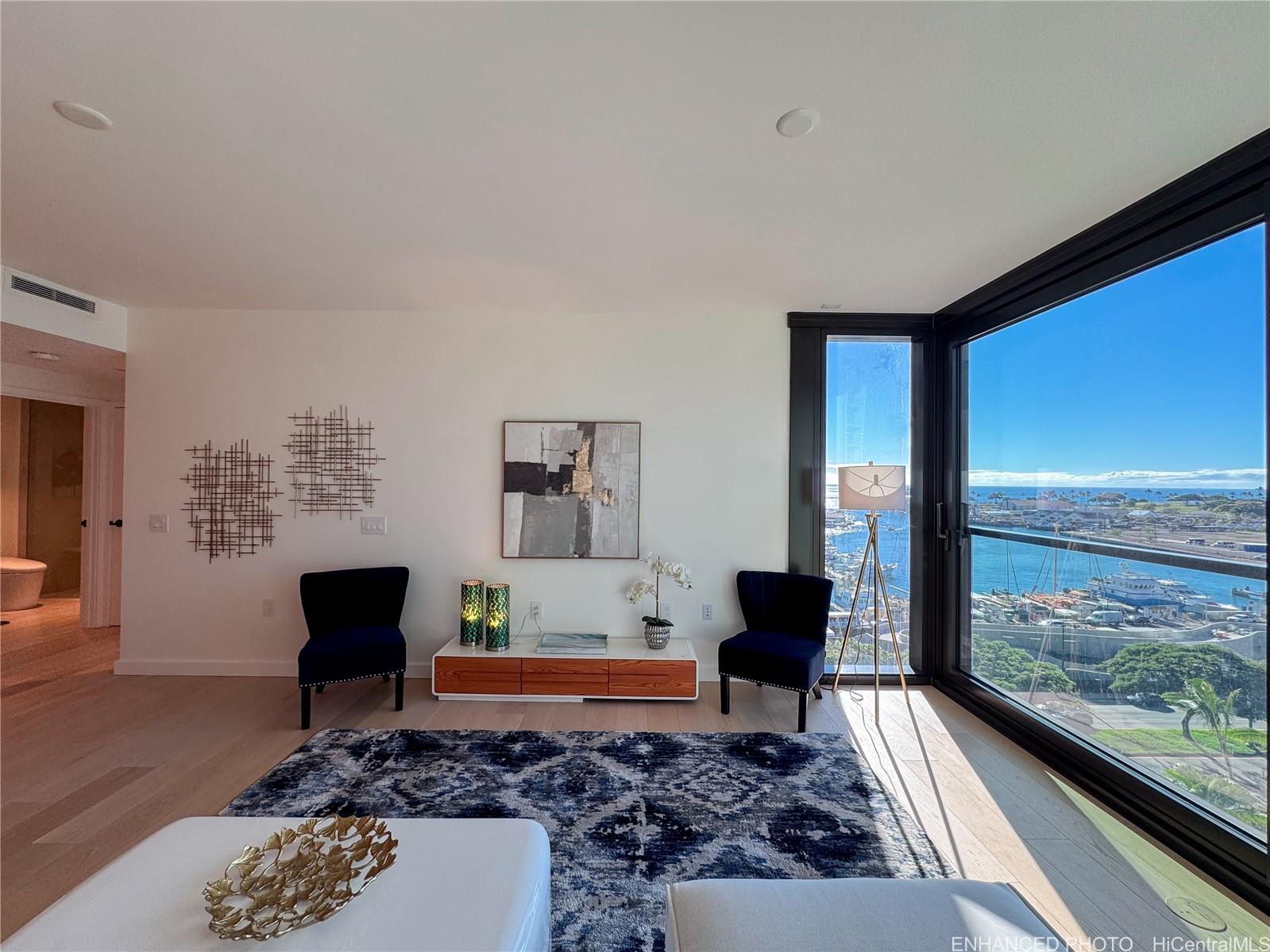 a living room with furniture and a large window