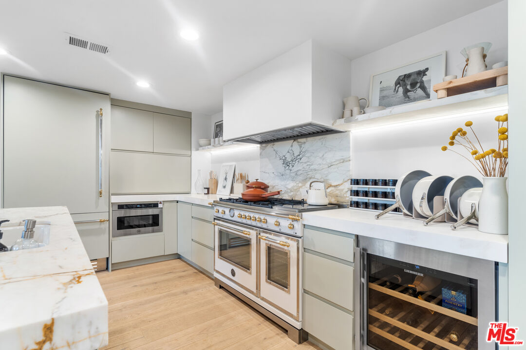 a kitchen with a stove and a sink