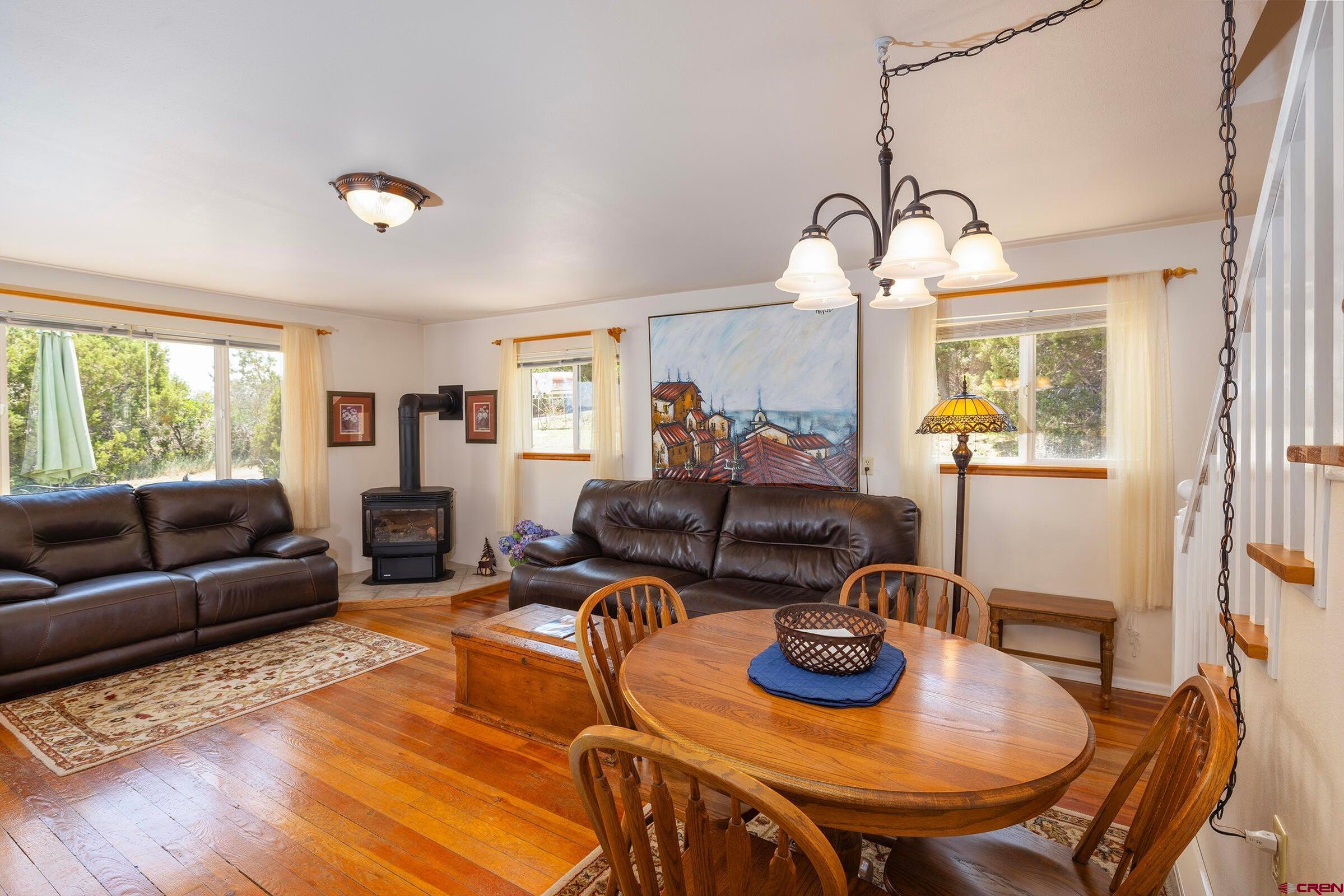 a living room with furniture a window and kitchen view