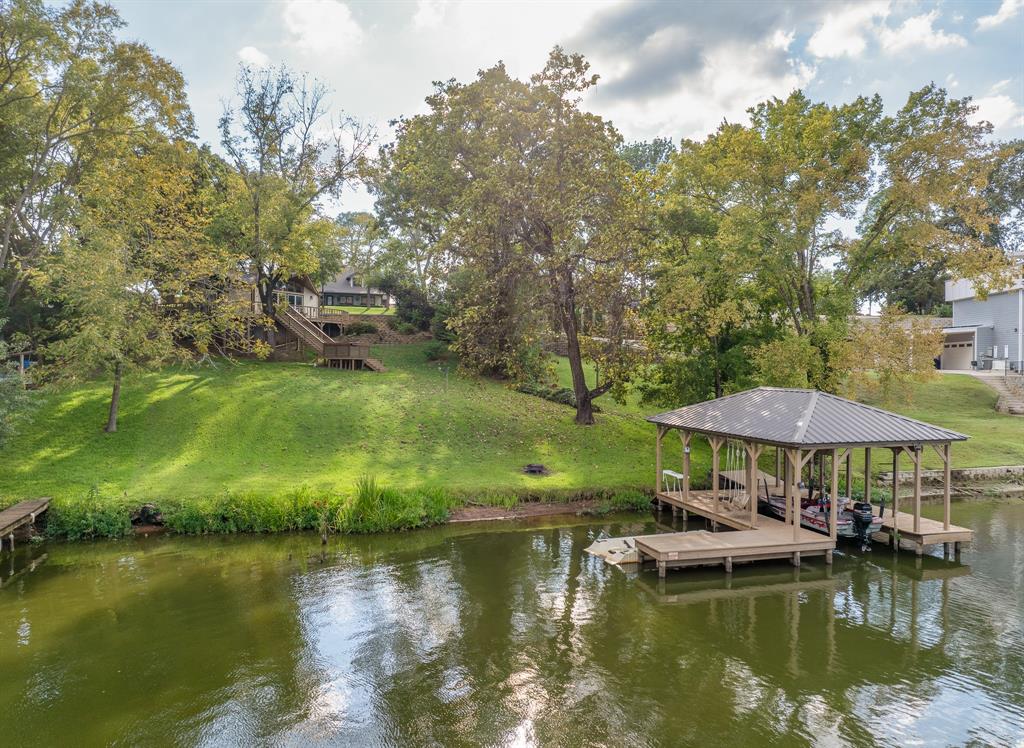 a view of a lake with outdoor seating