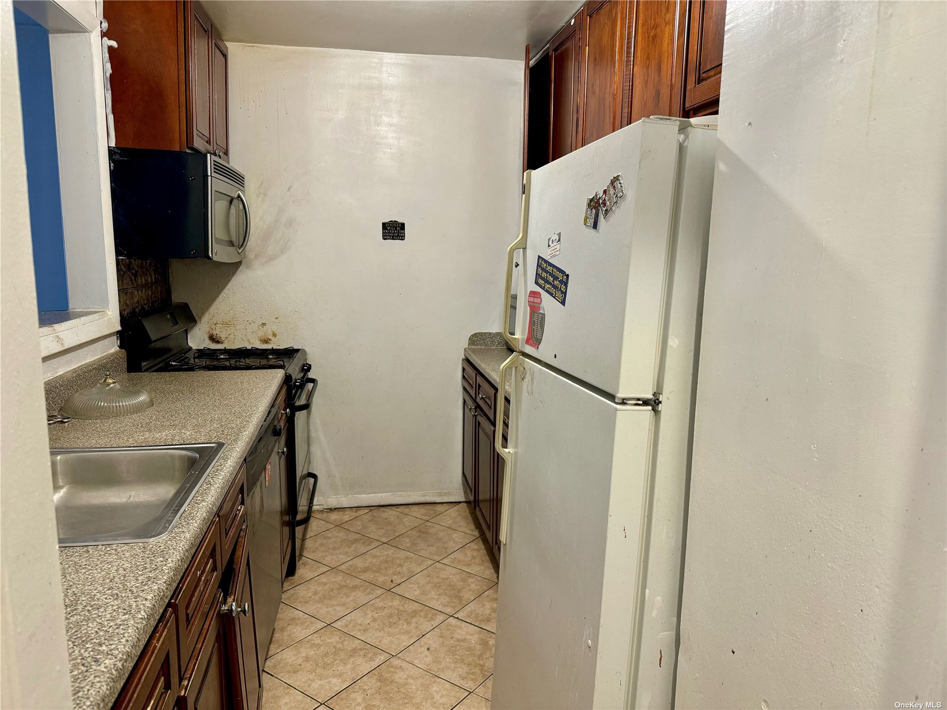 a white refrigerator freezer sitting inside of a kitchen