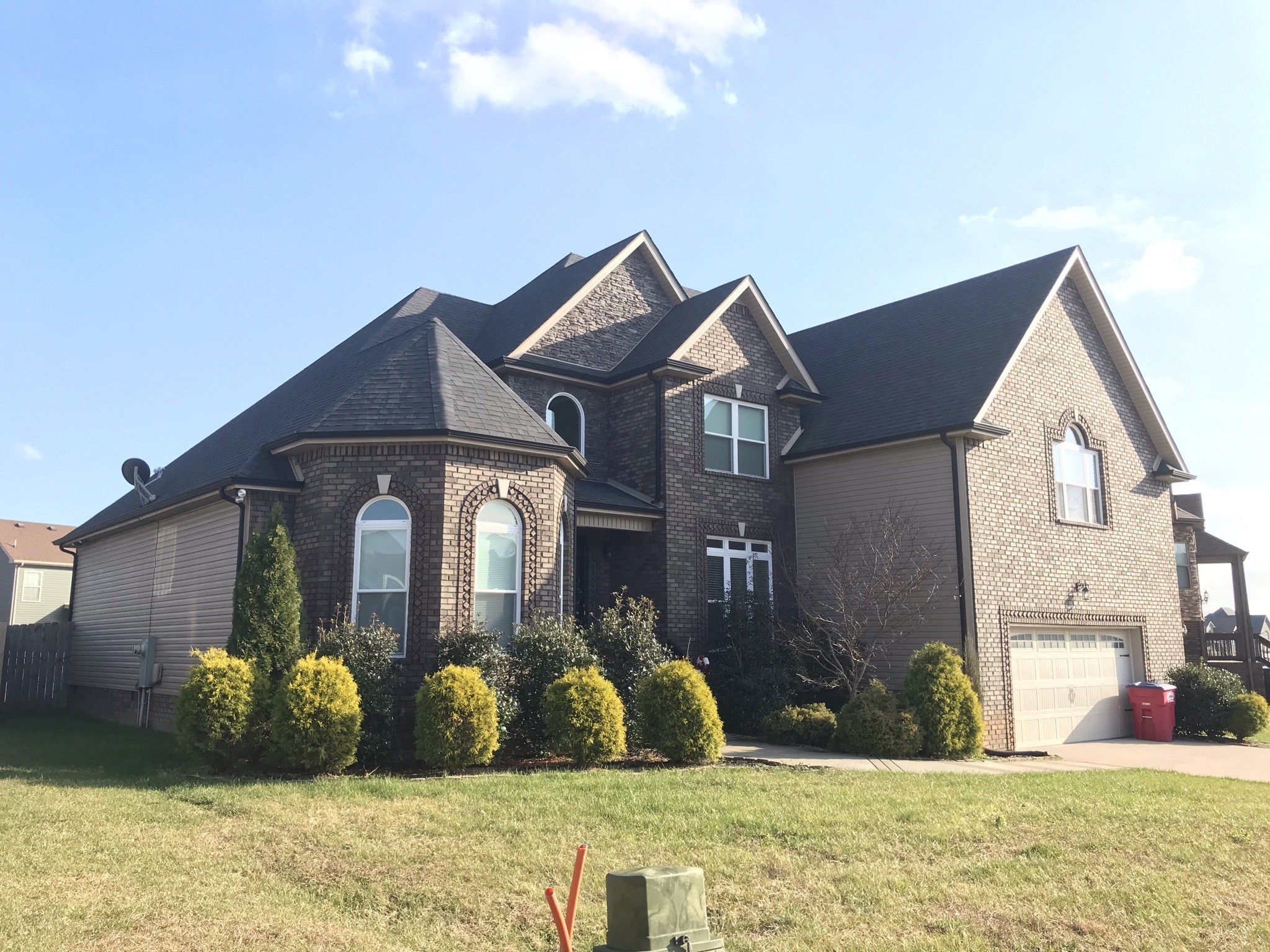 a front view of a house with a yard