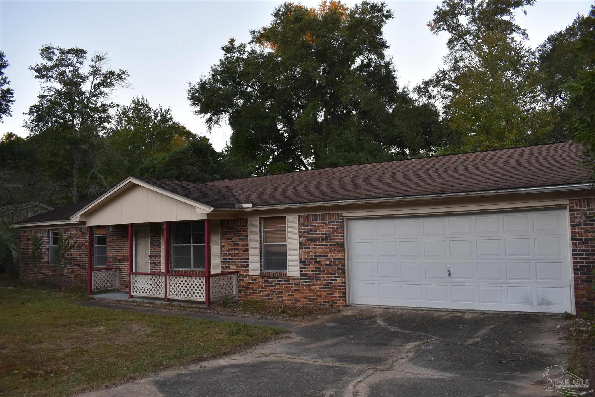 a front view of a house with a garage