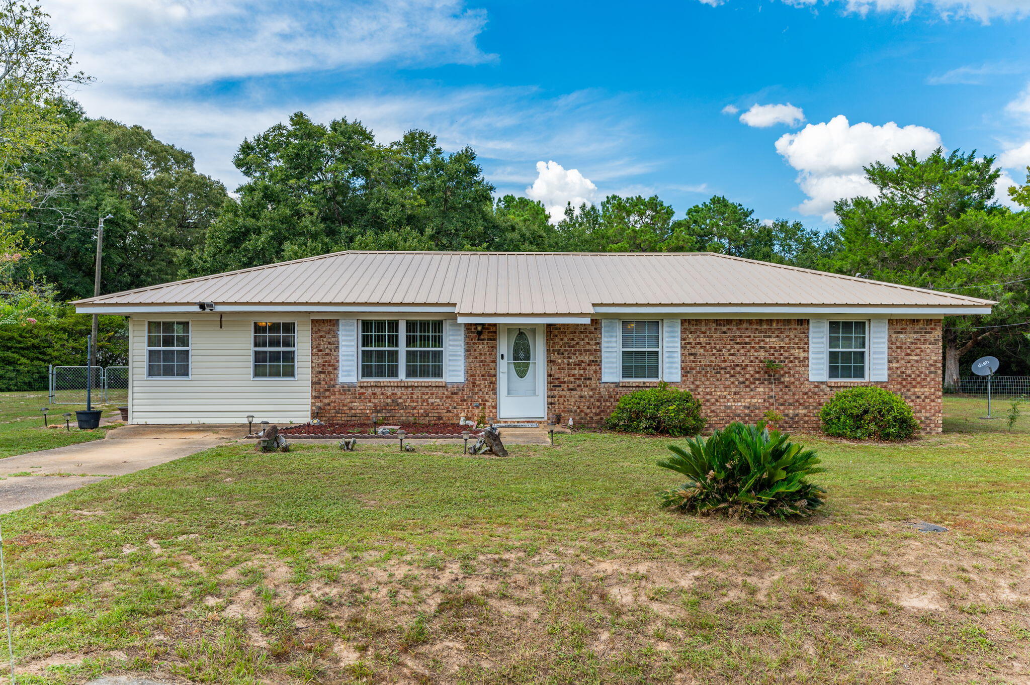 front view of a house with a yard