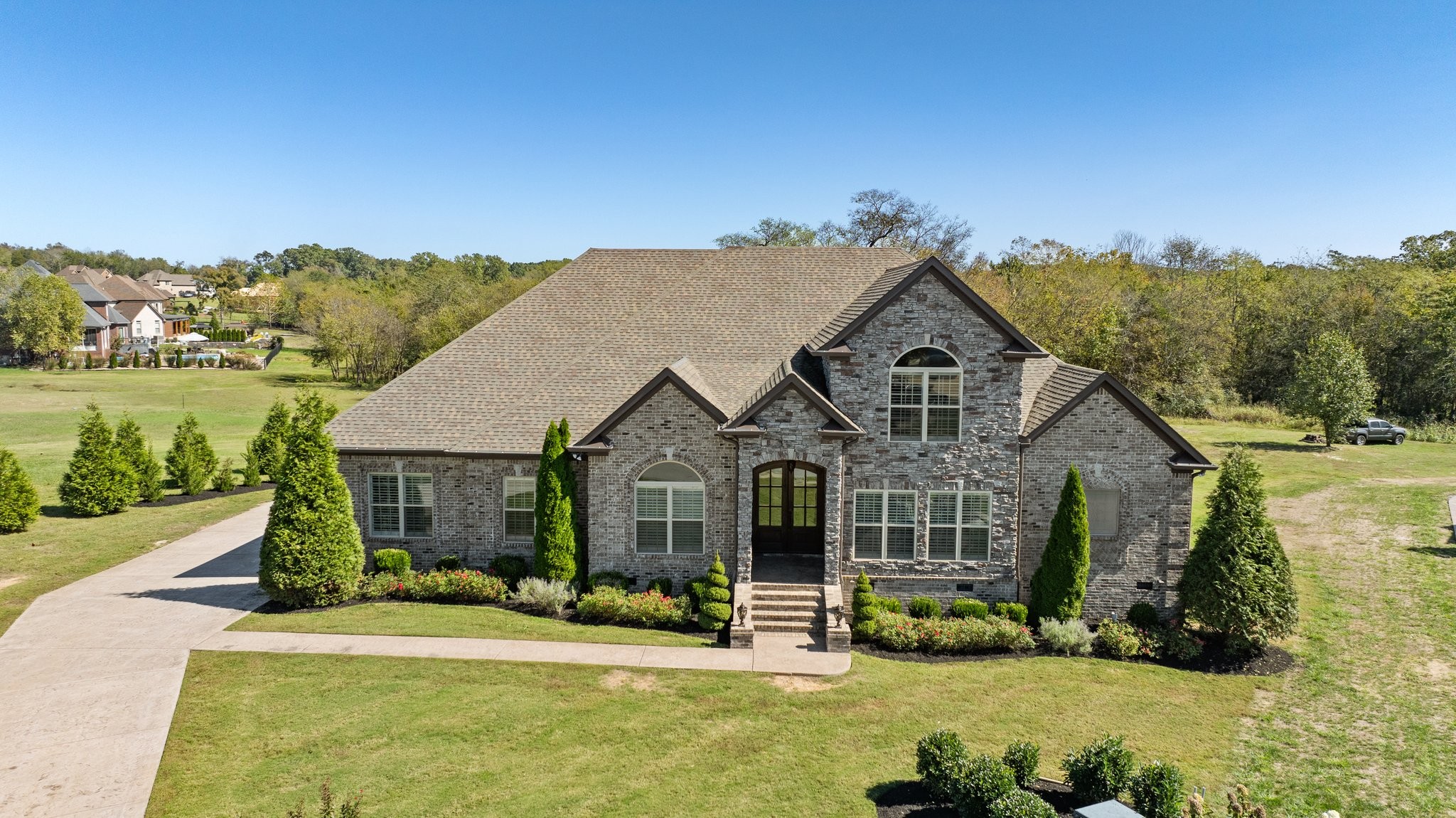 a front view of a house with a yard