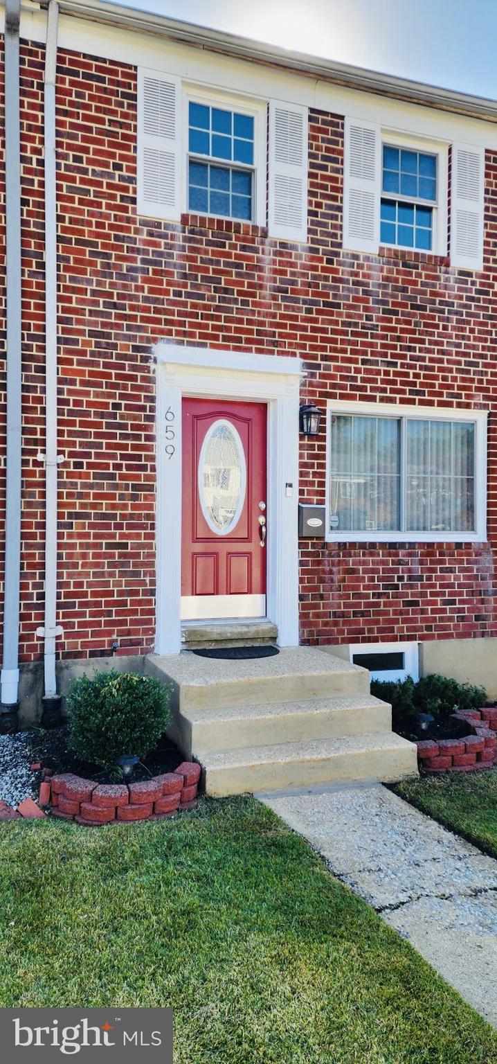 a sign that is in front of a brick building