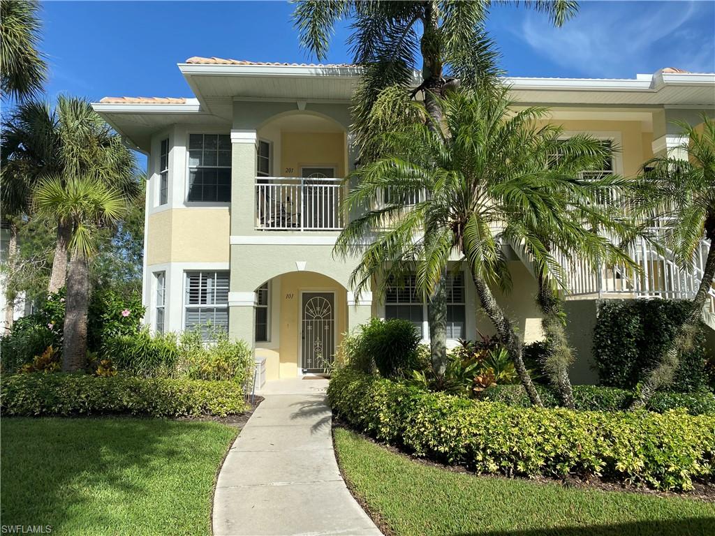 Mediterranean / spanish home featuring a balcony and a front yard