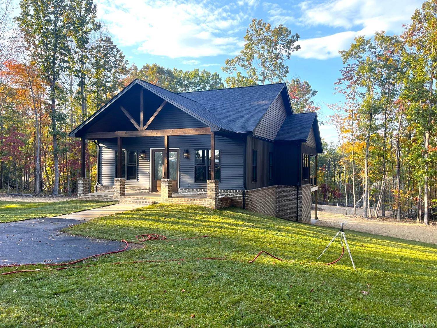 a view of a house with swimming pool and a yard