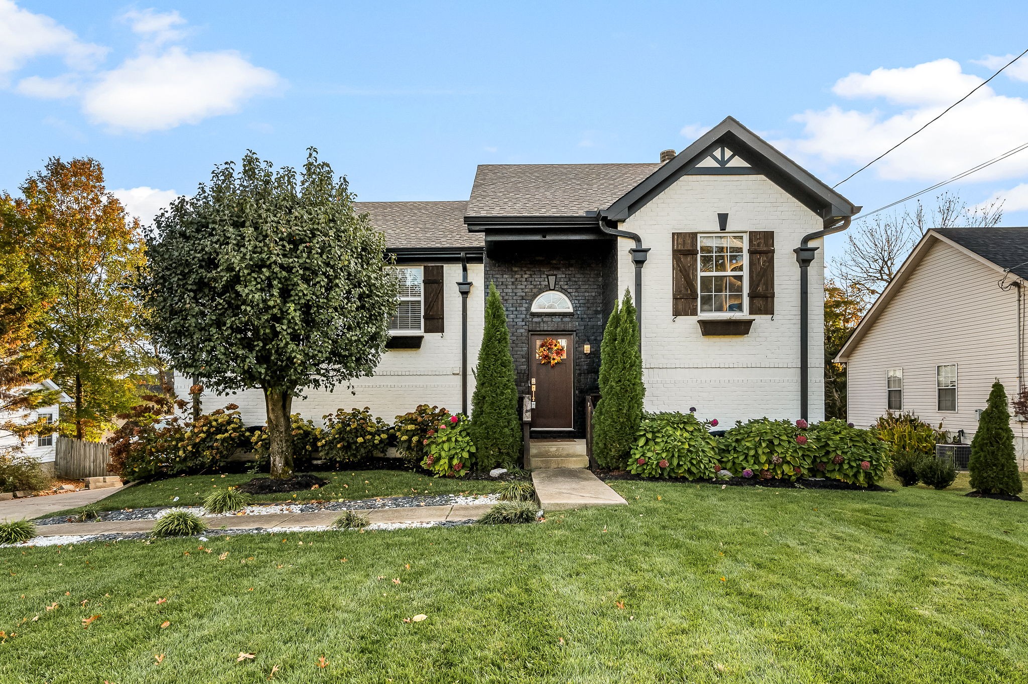 a front view of a house with a yard