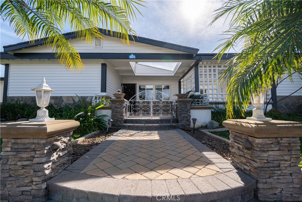 a front view of house with yard and outdoor seating