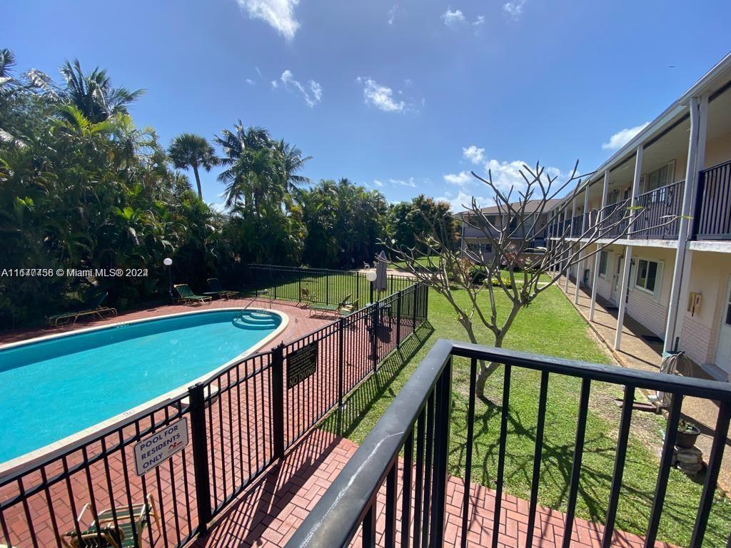 a view of swimming pool with seating