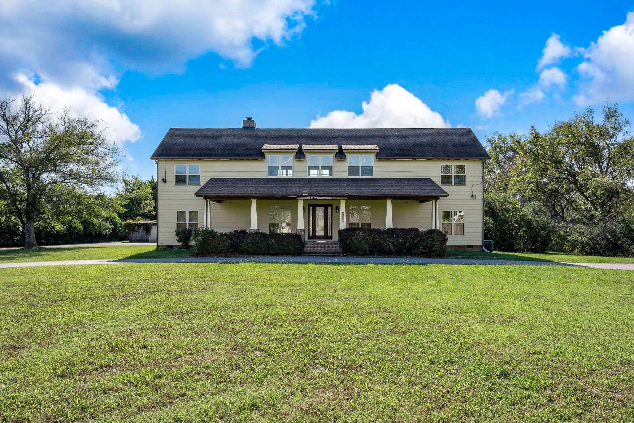 a front view of a house with a yard