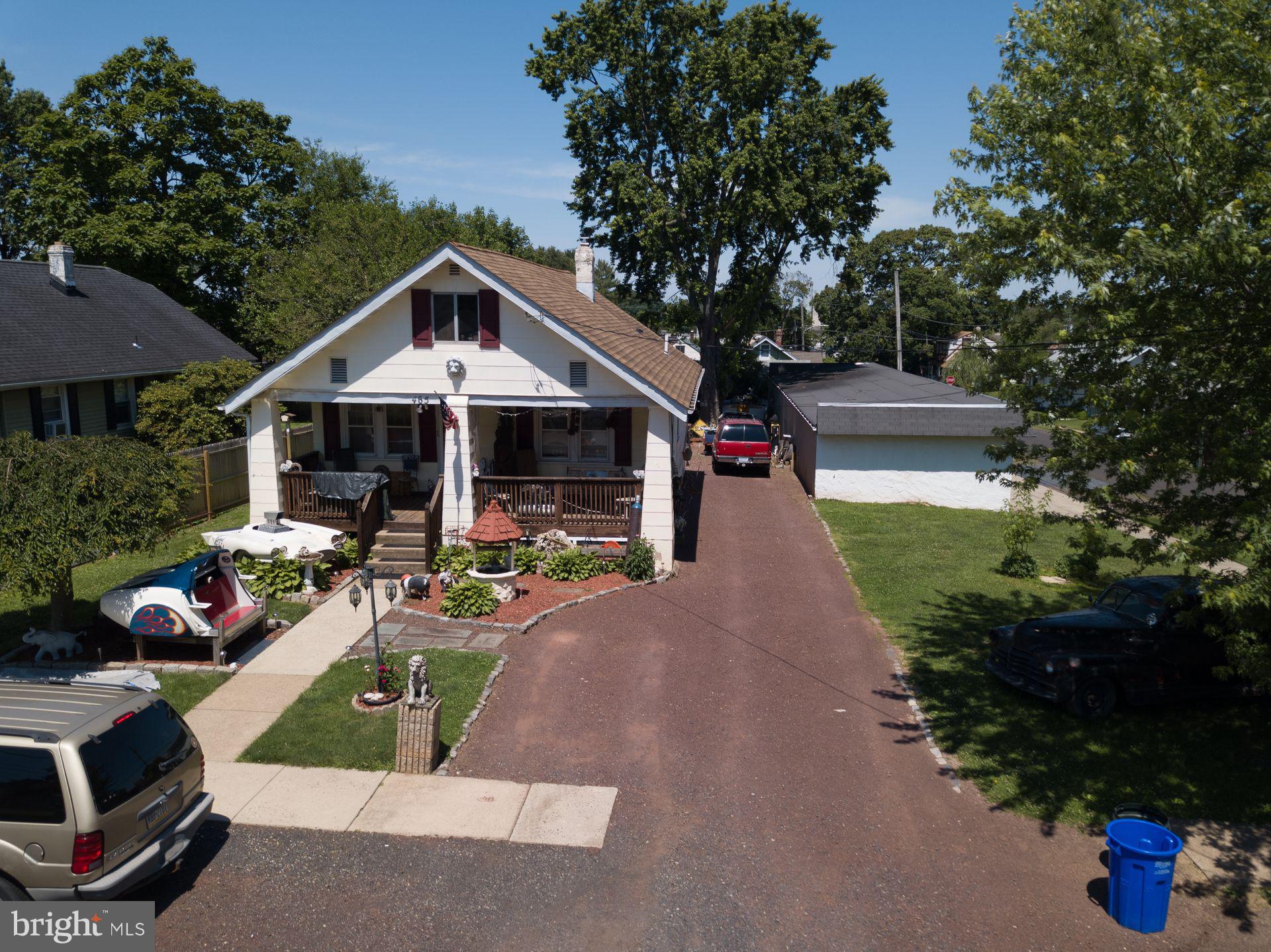 a view of a house with backyard porch and sitting area