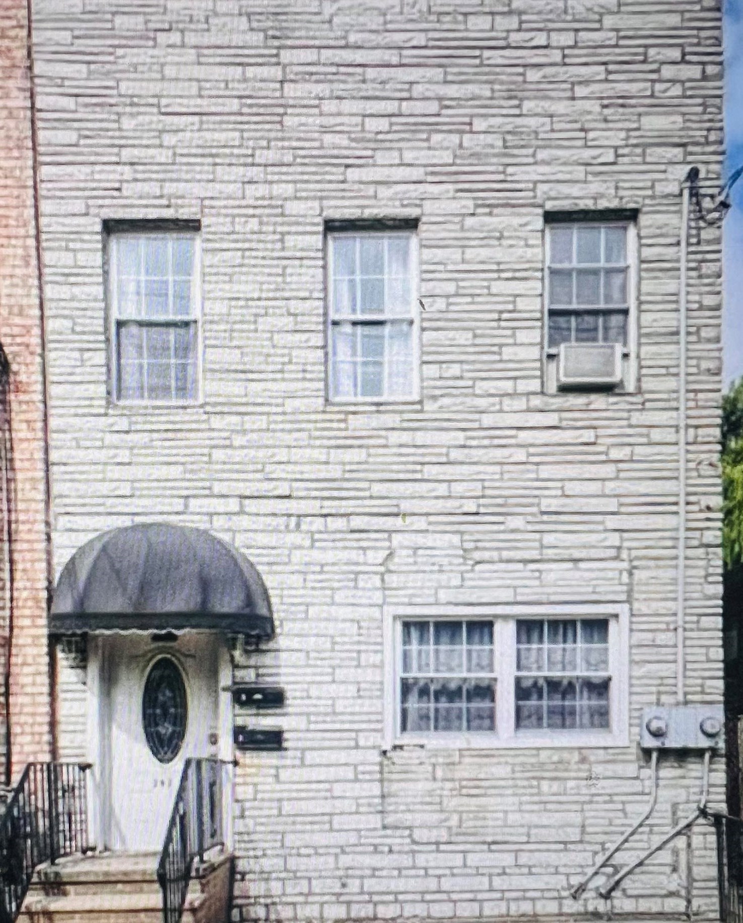 a front view of a house with stairs