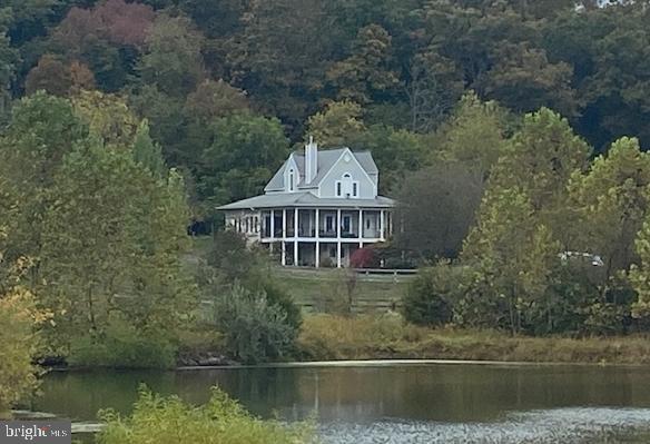 an aerial view of a house with a lake view