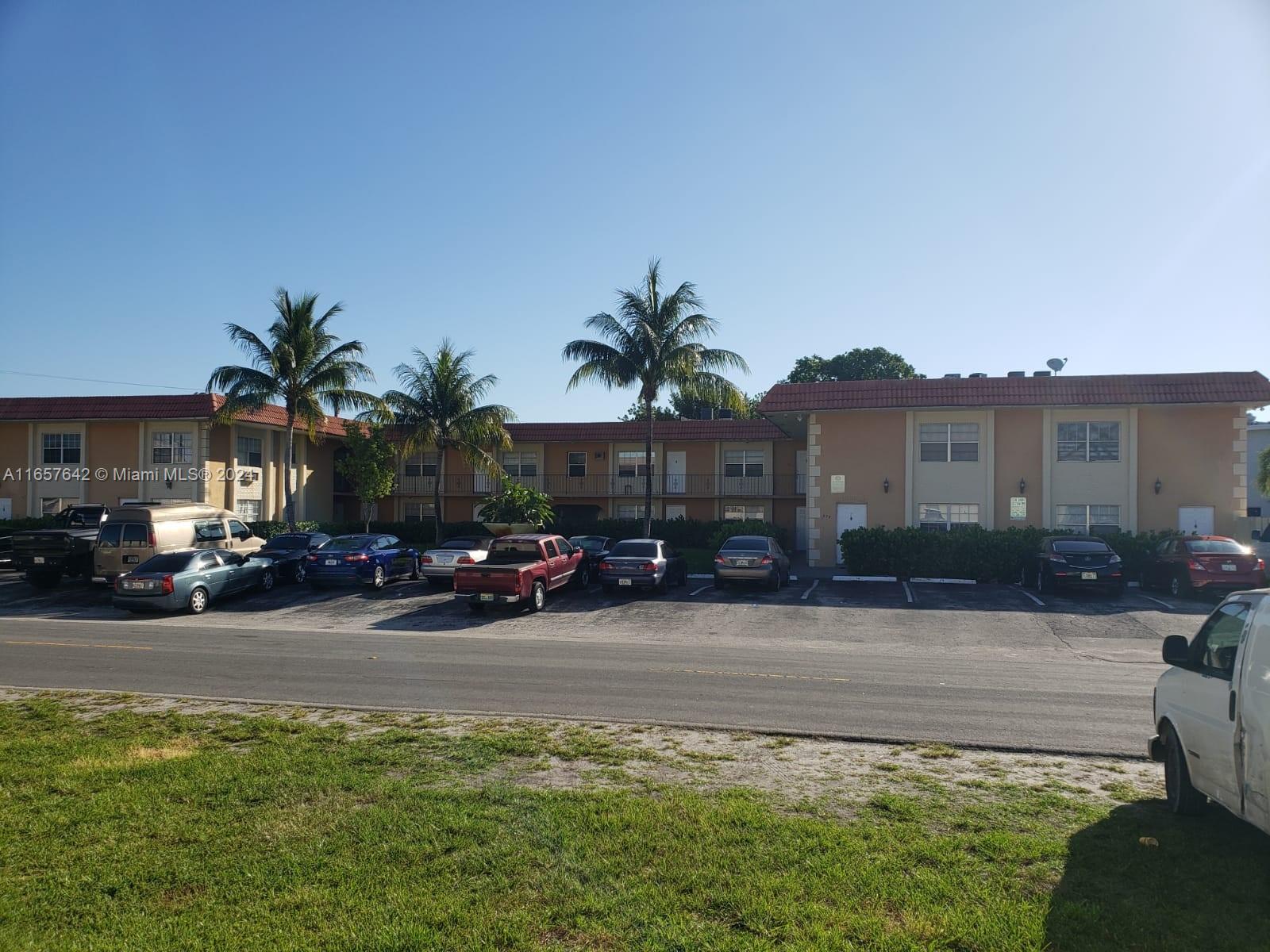 a couple of cars parked in front of a house