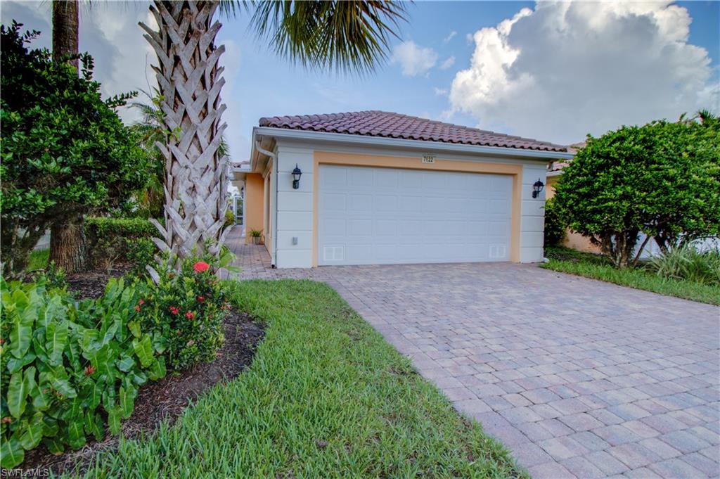 Front of home, 2 car attached garage with fresh epoxy floor