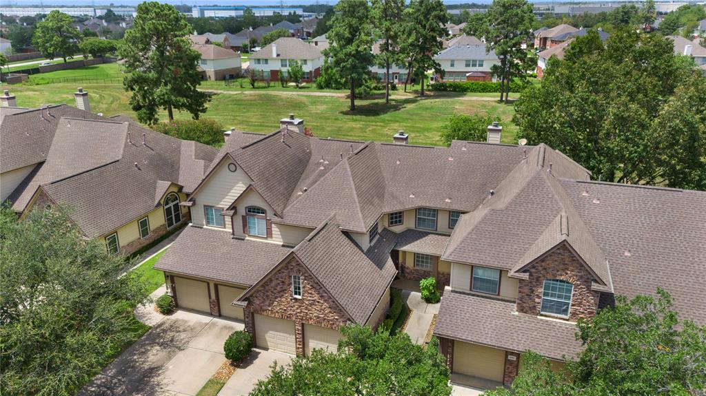 an aerial view of a house with big yard