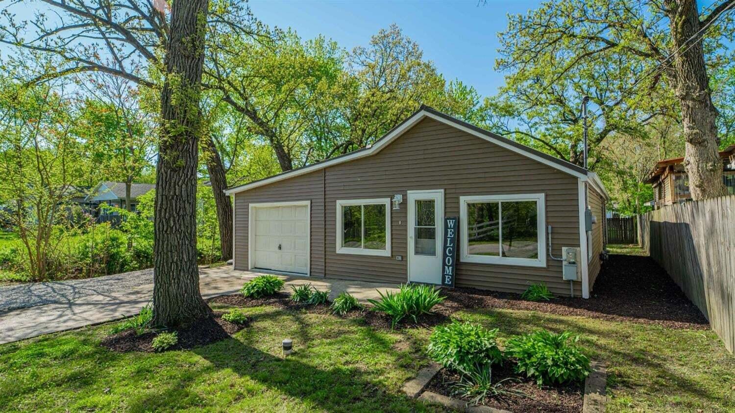 front view of a house with a yard