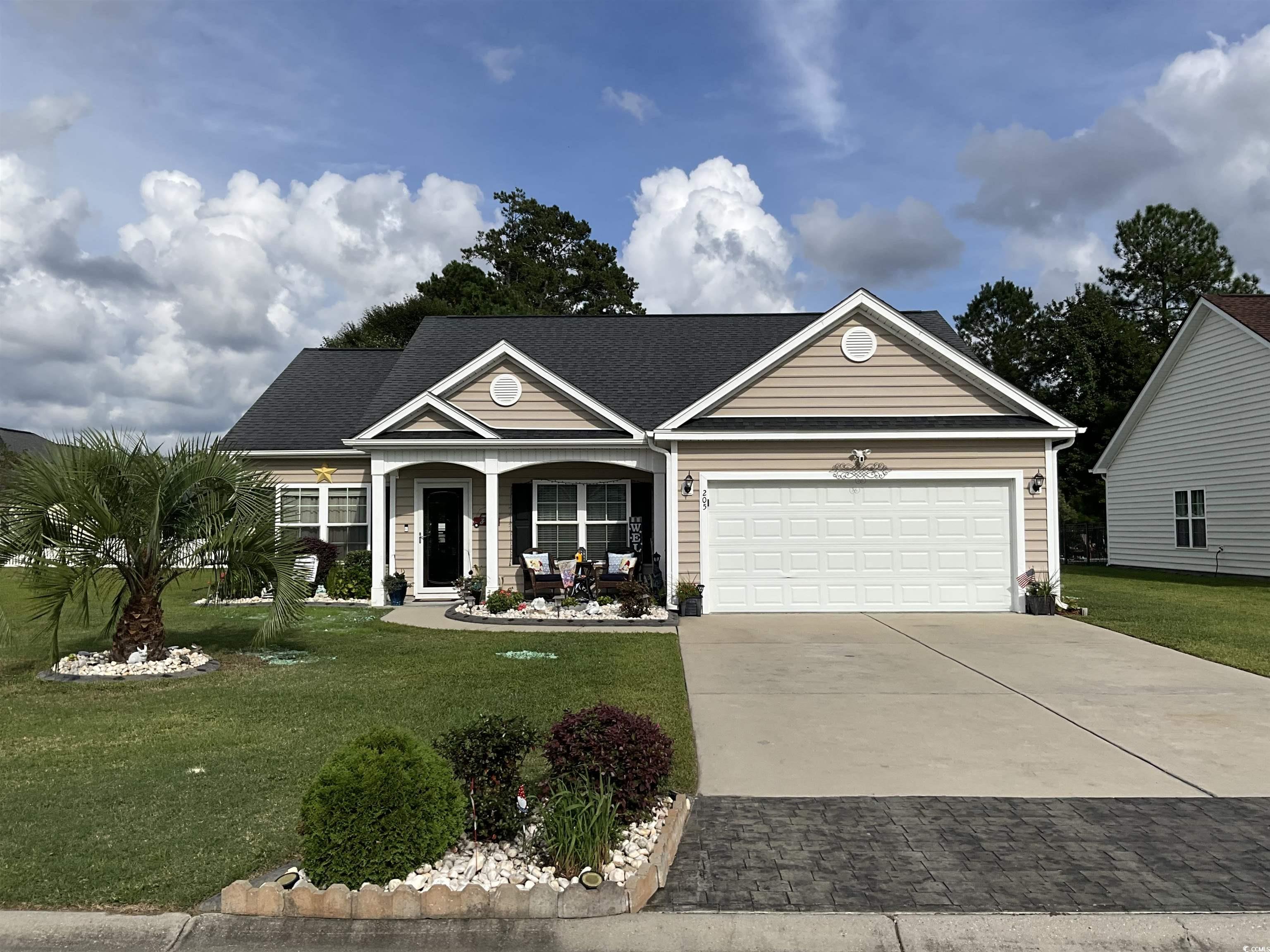 View of front of property with a front lawn and a