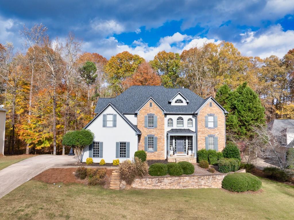 a front view of a house with a yard