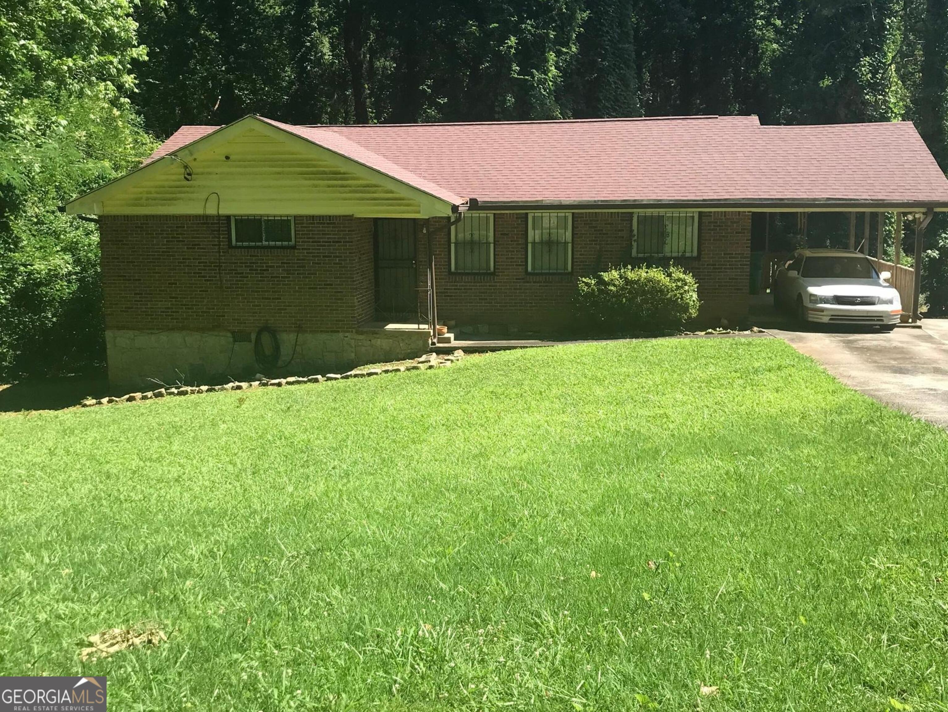 a front view of a house with garden