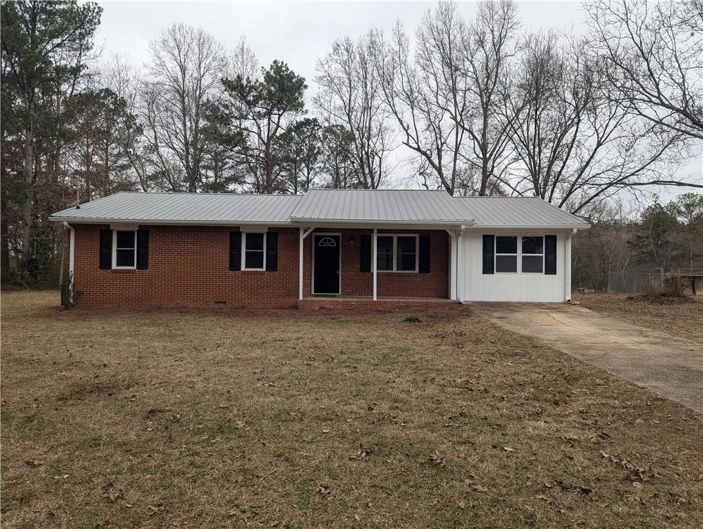 a front view of a house with yard