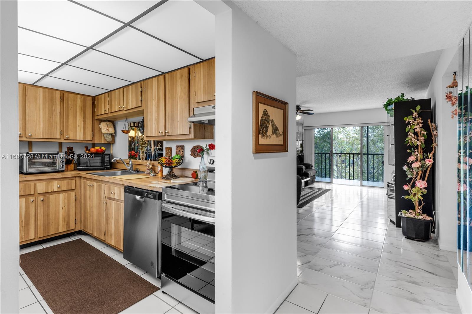 a kitchen with a sink cabinets and window