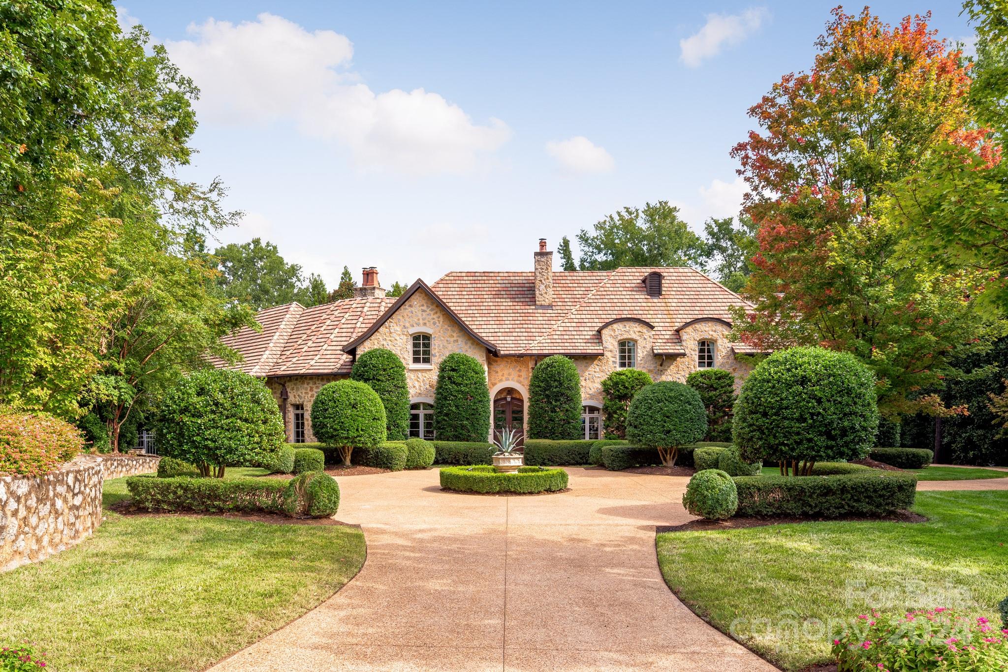 a view of a house with a swimming pool and a patio