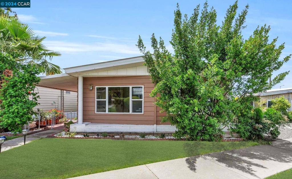 front view of a house with a yard