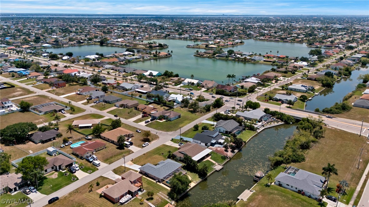 an aerial view of a city with ocean view