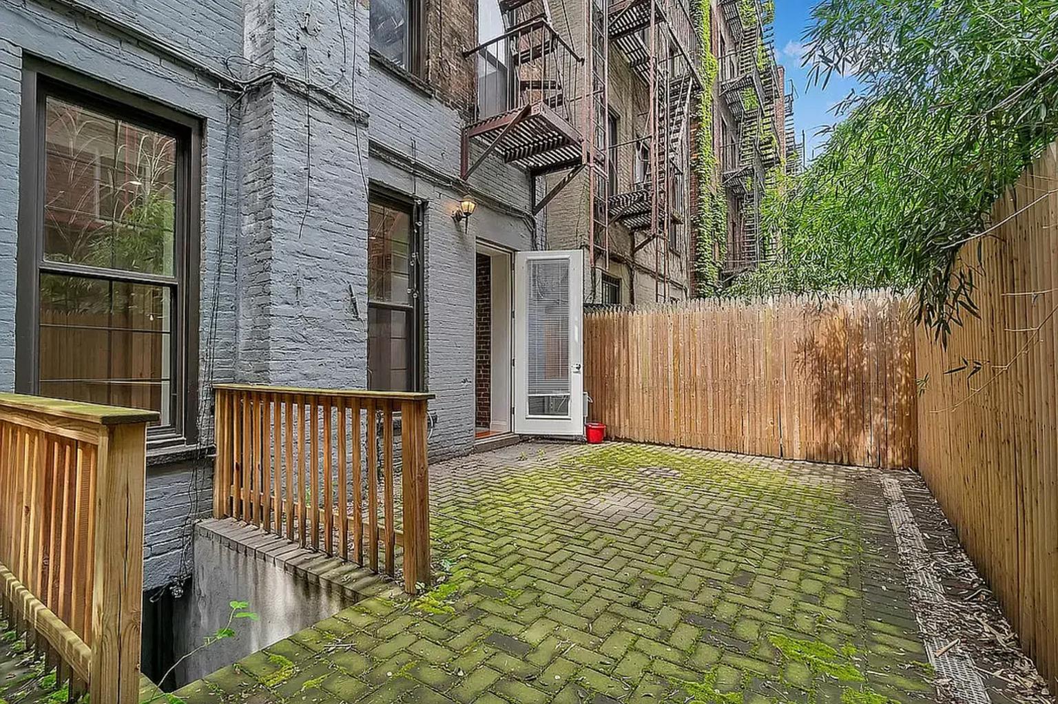 a view of a porch with a small yard