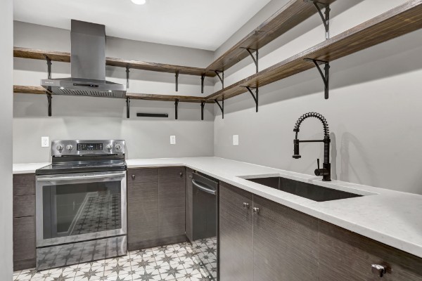 a kitchen with a sink and cabinets