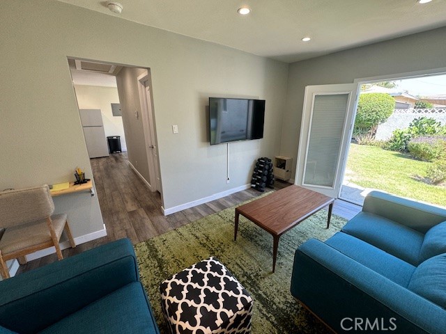 a living room with furniture rug and window