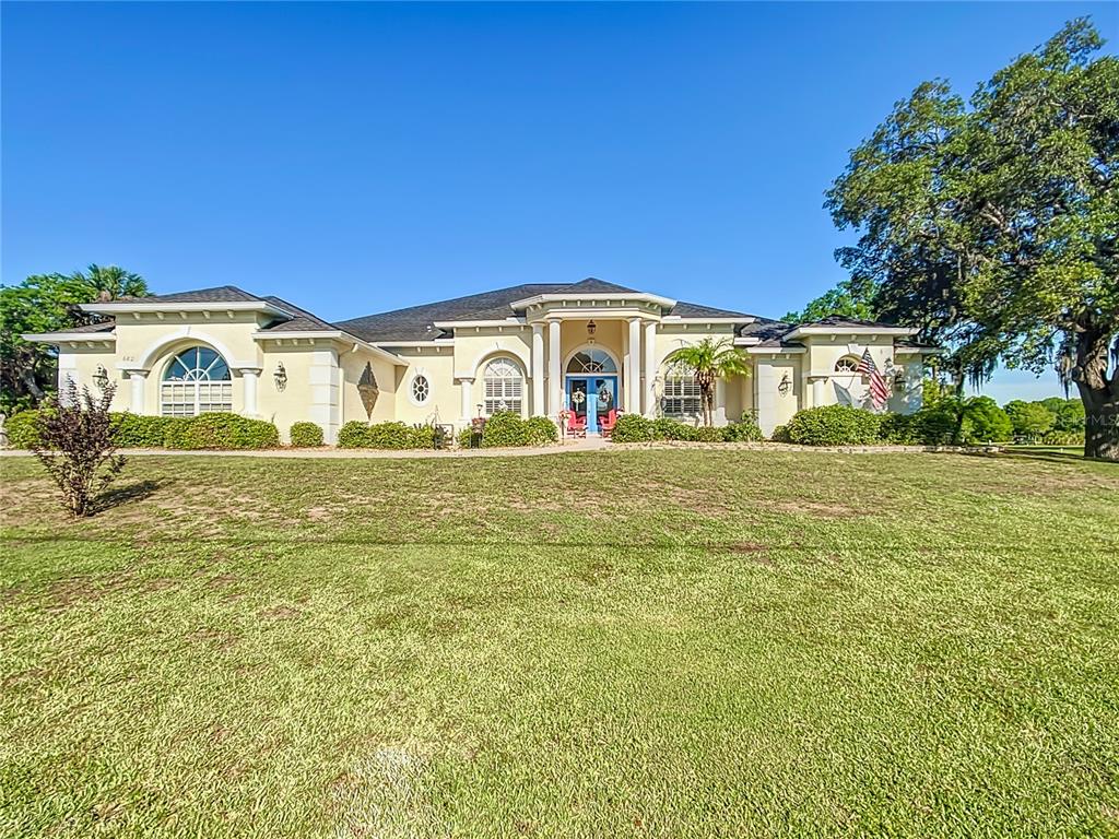 a front view of a house with a yard