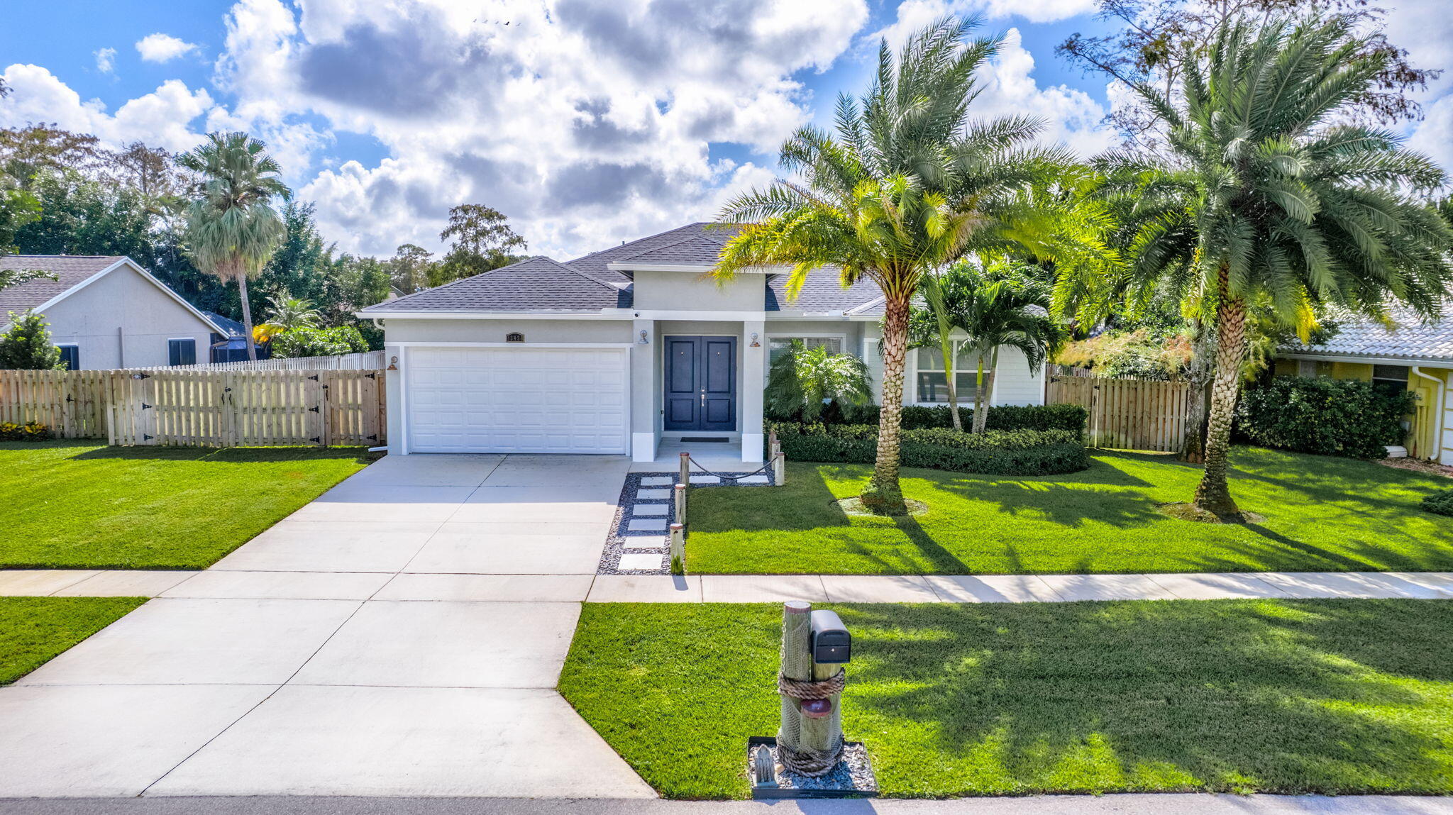 a front view of house with yard and green space