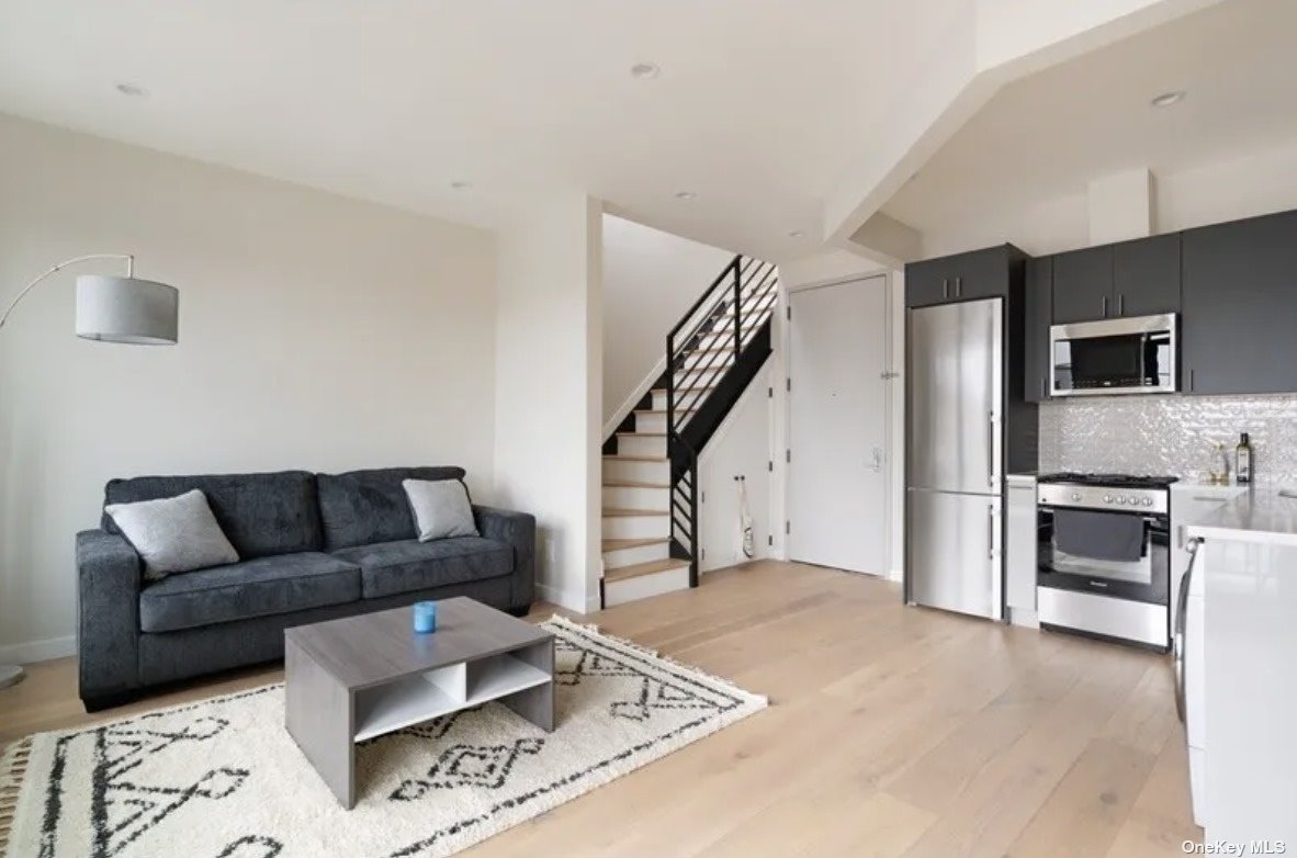 a living room with furniture and a rug