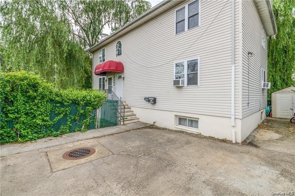 a view of a house with a yard and garage